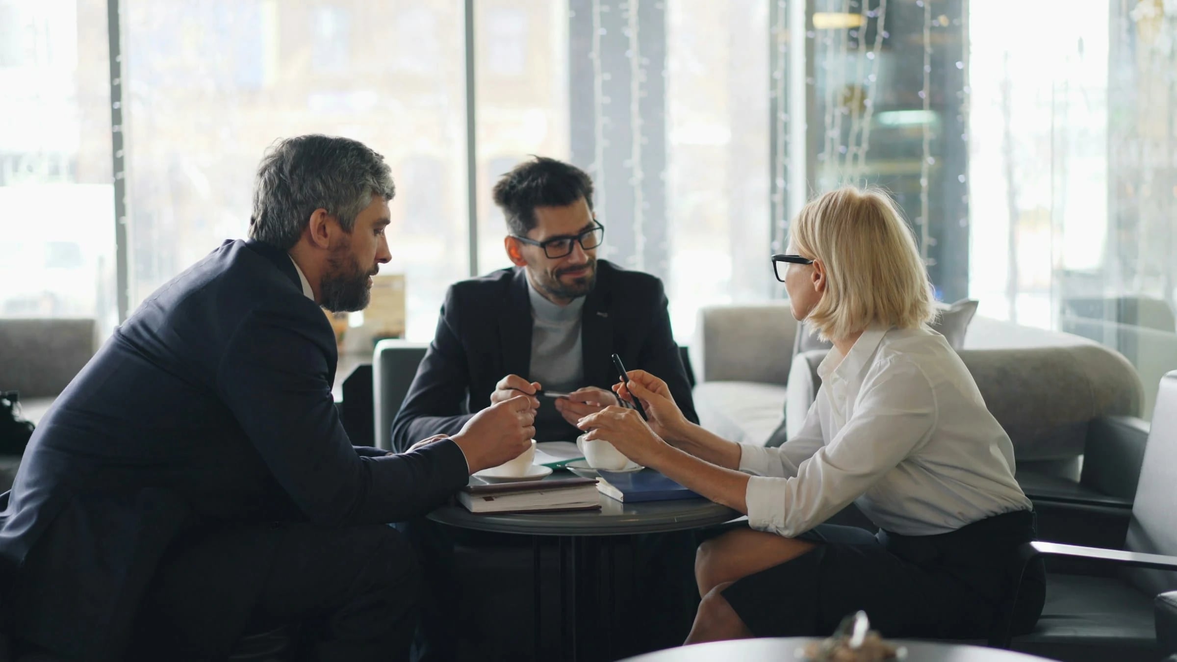 Consultants and practice owners meeting around a table