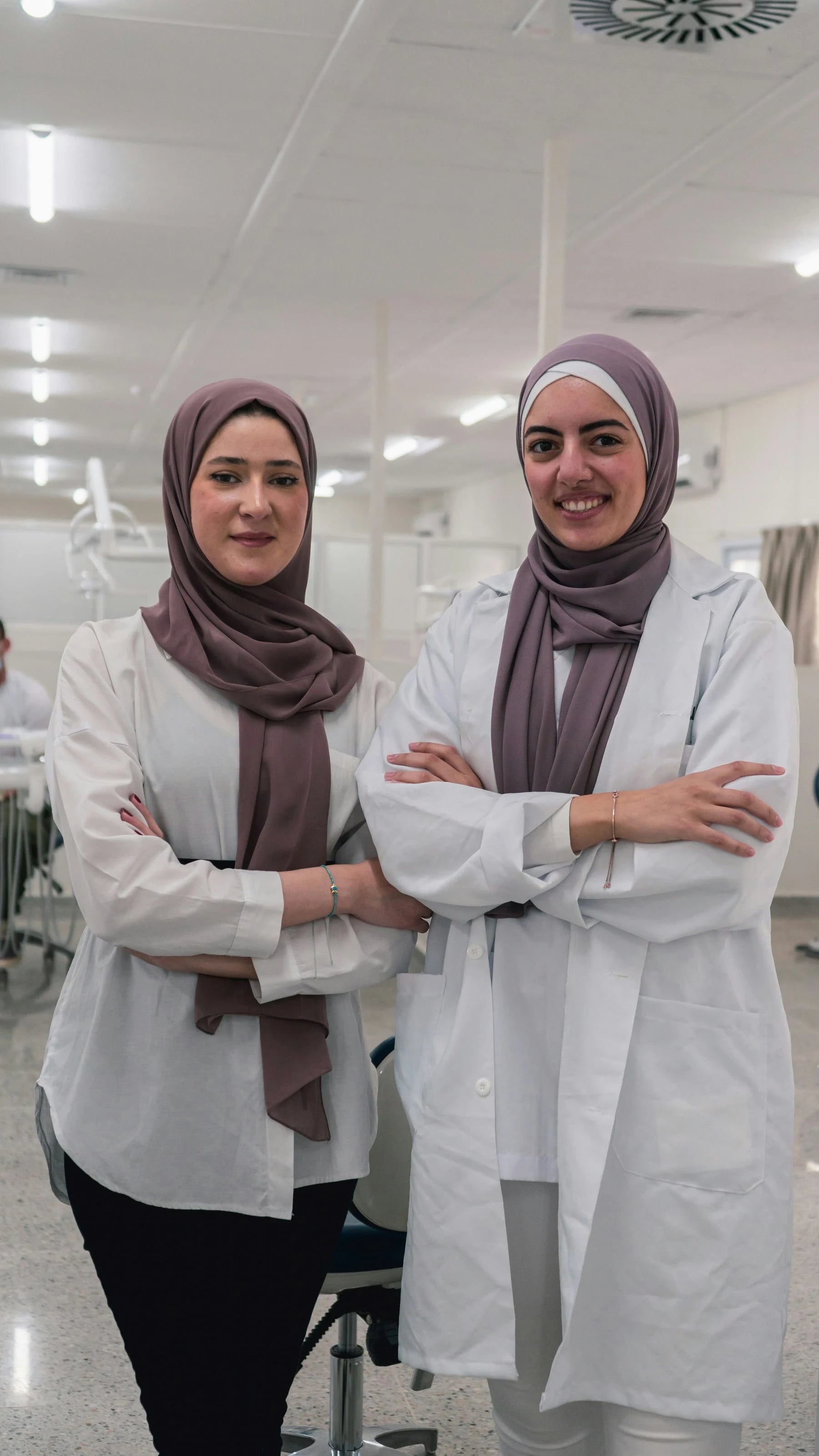 Two dentists standing together in a dental clinic