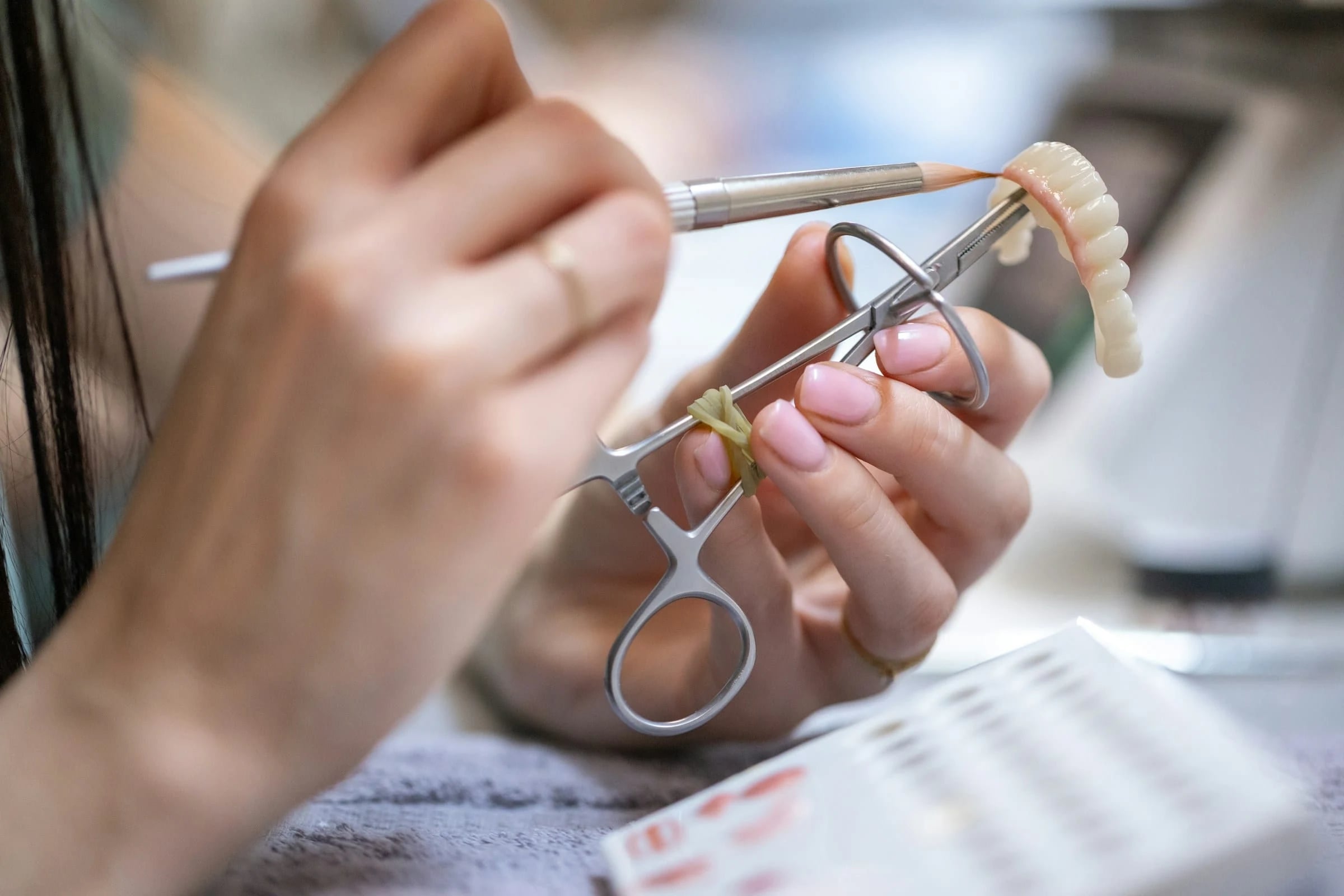 Dental technician crafting a dental prosthesis