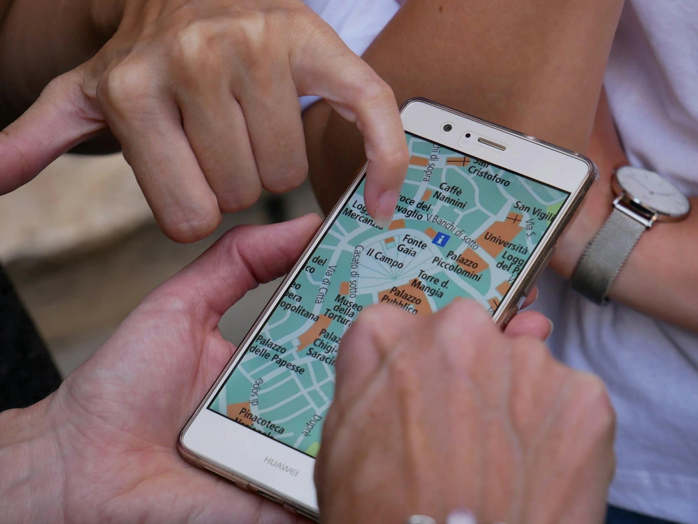 Person using a smartphone to search nearby