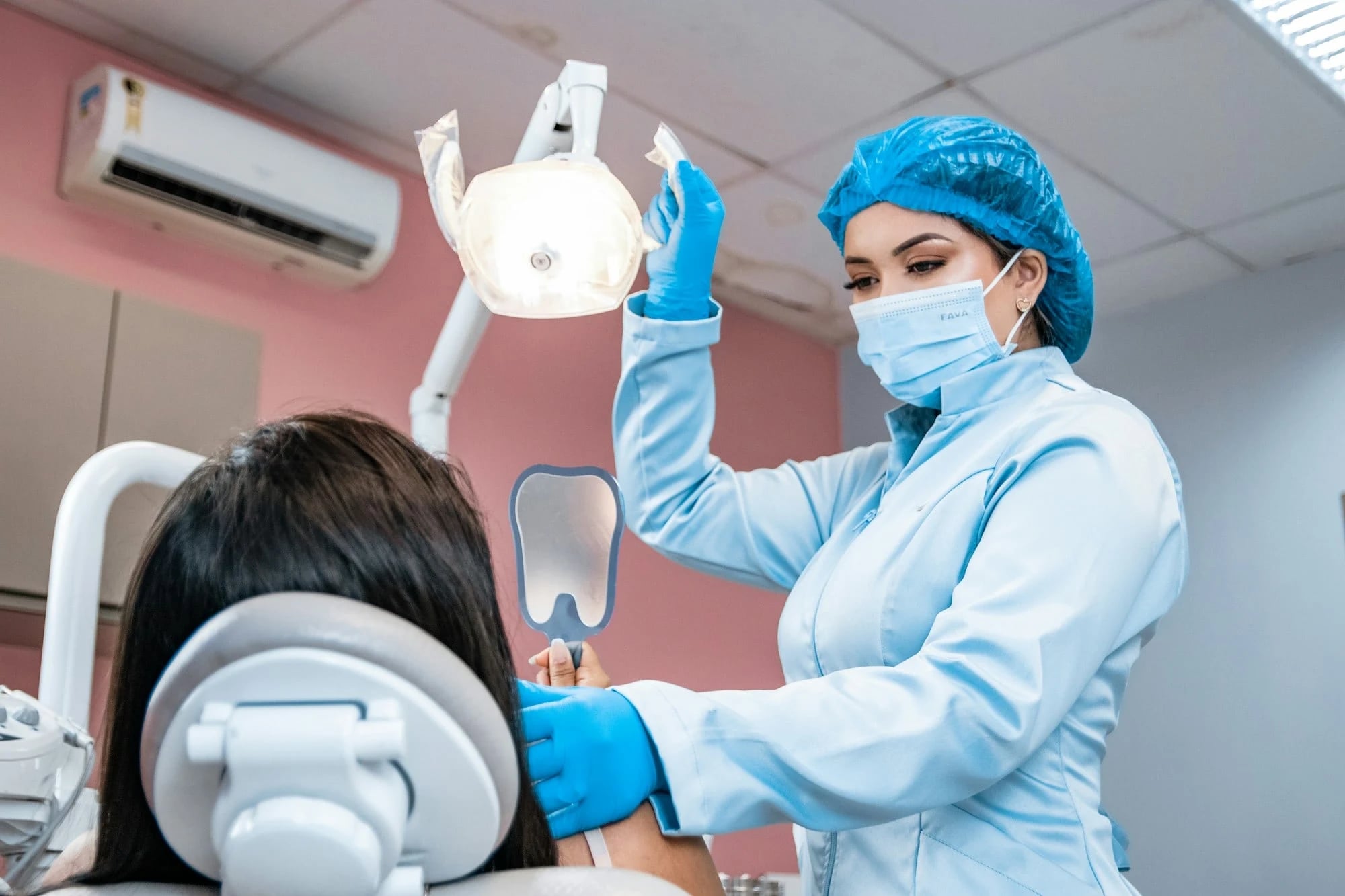 Patient having her teeth checked by a dentist